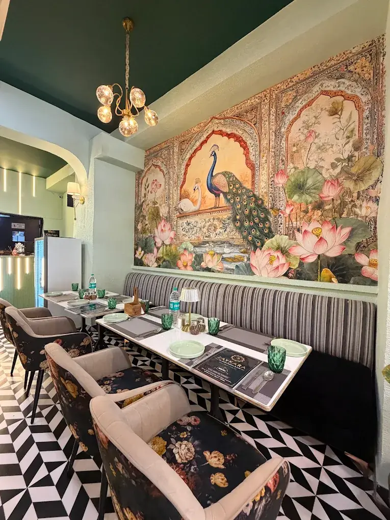 Peacock mural and set tables in the Zaykara dining room